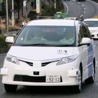 One of the driverless taxis to be put on a field test is shown to the media in Fujisawa, Kanagawa Prefecture, Monday. Fujisawa field tests start for Robot Taxi's driverless cabs