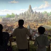 Visitors look at a painting at the Angkor Panorama Museum in Siem Reap province on Feb. 16. Cambodia a canvas for North Korea's master artists