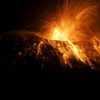 Ecuador's Tungurahua volcano spews smoke and ash near Banos Saturday. Ecuador volcano spews towering ash, gas plume