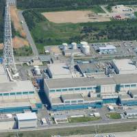 The No. 6 (center) and No. 7 (right) reactors at Tokyo Electric Power Co.'s Kashiwazaki-Kariwa nuclear power plant in Niigata Prefecture, appearing in a photo taken in May last year, are set to be prolonged further. Safety checks for Tepco's Kashiwazaki-Kariwa nuclear plant to be prolonged