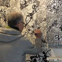 Born again: Artist Takeshi Kawashima puts the finishing touches to his work Kaleidoscope Black and White on Ogijima Island. Until recently facing a shrinking, aging population, Ogijima is growing thanks to its thriving community-based art scene. Seto Inland Sea island finds salvation through art, but on its residents' own terms