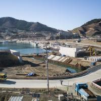 Rebirth: Reconstruction progresses in December at a bay in the Miyagi Prefecture town of Onagawa that was destroyed in the tsunami of March 11, 2011. Immigration: the missing piece in the Tohoku recovery puzzle?