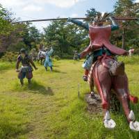 A horse soldier storms through a field at The Immersion Museum — Sekigahara War Land. Battle of Sekigahara: a war set in stone