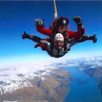 Totally present in the moment: Andrew Benson (bottom) experiences a tandem jump above the Remarkables mountain range near Queenstown, New Zealand. Find thrills amid spectacular scenery in New Zealand