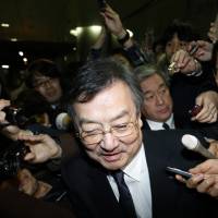 Sharp Corp. Chief Executive Officer Kozo Takahashi leaves the company’s Tokyo headquarters on Feb. 25 after reports of Sharp agreeing to a takeover by Taiwan’s Foxconn. National pride obscures harsh truth about Sharp deal