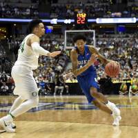 Duke's Brandon Ingram drives on Oregon's Dillon Brooks in their NCAA Tournament game on Thursday night in Anaheim, California. Oregon won 82-68. Top-seeded Oregon ousts Duke