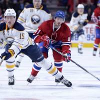 Buffalo's Jack Eichel (left) controls the puck as Montreal's Paul Byron chases during the Canadiens' 3-2 win on Thursday. Subban injury mars Canadiens' win