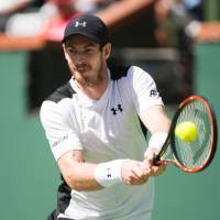 Andy Murray plays a shot from Argentina's Federico Delbonis in their third-round match at the BNP Paribas Open on Monday. Delbonis won 6-4, 4-6, 7-6 (7-3). Murray eliminated in third round at BNP Paribas Open