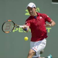 Kei Nishikori plays a shot during his 6-2, 7-6 (7-4) win over Pierre Hugues-Herbert on Saturday. Clinical Nishikori starts Miami Open campaign with win
