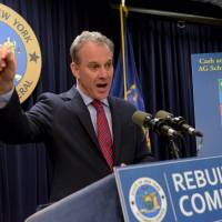 Attorney General Eric Schneiderman speaks at a news conference in the Manhattan borough in New York Monday. Goldman Sachs Group has agreed to pay $5.06 billion to settle claims that it misled mortgage bond investors during the financial crisis, the U.S. Department of Justice said on Monday. Goldman to pay $5.1 billion for misleading investors in mortgage-backed securities