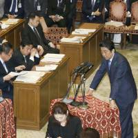 Prime Minister Shinzo Abe answers questions during a debate held Monday by the House of Representatives' special committee on the Trans-Pacific Partnership. Japan Diet panel resumes debates on TPP