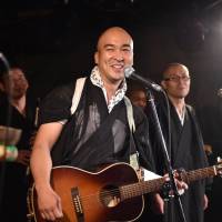 Representing Buddha: Monk Yoshinobu Fujioka has paired up with Christian pastor Kazuhiro Sekino to spread good vibes through music. Religious duel: Pastor rock vs. Buddhist monk blues