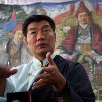 Lobsang Sangay, the prime minister of the Tibetan government-in-exile, speaks to reporters after being re-elected for second term in Dharmsala, India, on Wednesday. Lobsang Sangay re-elected as prime minister of Tibetan government-in-exile