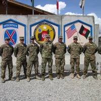U.S. commander for Afghanistan, Gen. John Nicholson (fourth, left) poses for pictures at forward operating base Gamberi, Laghman province, on April 4. Al-Qaida seen cozying up to Taliban, upping threat against U.S., NATO in Afghanistan
