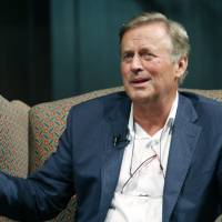 Best-selling author and former Mississippi lawmaker John Grisham speaks about his writing process at the Mississippi Book Festival, at Galloway Methodist Church Sanctuary, in Jackson, Mississippi, last August. Ninety-five Mississippi authors, including Grisham and Donna Tartt, are calling on state officials to repeal a law that will let government workers and businesspeople cite religious beliefs to deny services to lesbian, gay, bisexual or transgender people. Grisham, 94 other Mississippi authors demand anti-LGBT law be repealed