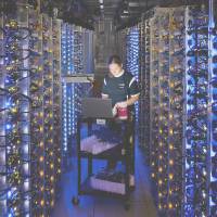 A Google employee works at a data center in The Dalles, Oregon. Google and civil liberties groups oppose expanding the ability of the FBI to hack into computer networks. FBI to gain new hacking power if Supreme Court approves search warrant rule change