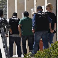 Police escort Australian Sally Faulkner, the mother of the al-Amin children, and Australian reporter Tara Brown, to Lebanon’s Baabda Prison for women, after their trial was adjourned on Monday. Lebanese dad refuses to drop charges over Aussie wife's bid, with TV crew, to snatch kids back