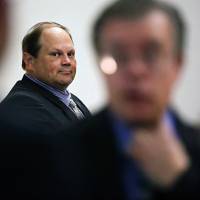 Eddie Tipton, former security director of the Multi-State Lottery Association, looks toward his lawyers before the start of his trial last July in Des Moines, Iowa. A group of state lotteries has asked a judge to dismiss a lawsuit filed by a jackpot winner who argues he was shortchanged by millions of dollars because the prior drawing was rigged by one of its employees. Tipton has been convicted of rigging a $16.5 million jackpot in December 2010. U.S. lottery vendor accused of rigging drawings allegedly installed code that predicted winners