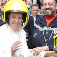 Pope Francis wears a helmet of Paris’ French firemen (Pompiers de Paris) at the end of his weekly general audience at the Vatican Wednesday. Great Schism on mend: Pope, Orthodox leader to show solidarity in visit with refugees in limbo in Greece