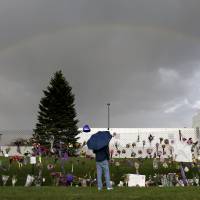 A rainbow appears over Paisley Park near a memorial for Prince on Thursday in Chanhassen, Minnesota. A day with Prince at Paisley Park
