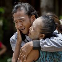 Fformer slave fisherman Myint Naing and his mother, Khin Than, cry as they are reunited last May after 22 years at their village in Mon State, Myanmar. The Associated Press won the Pulitzer Prize on Monday for public service for articles documenting the use of slave labor in the commercial seafood industry in Indonesia and Thailand. AP bags centennial Pulitzer for expose on Southeast Asia slaves processing seafood for U.S.