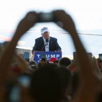 Republican presidential candidate Donald Trump speaks at a rally in a hangar at Rider Jet Center on Sunday in Hagerstown, Maryland. Trump camp denies candidate out to fool voters; even some U.S. Muslims are sold