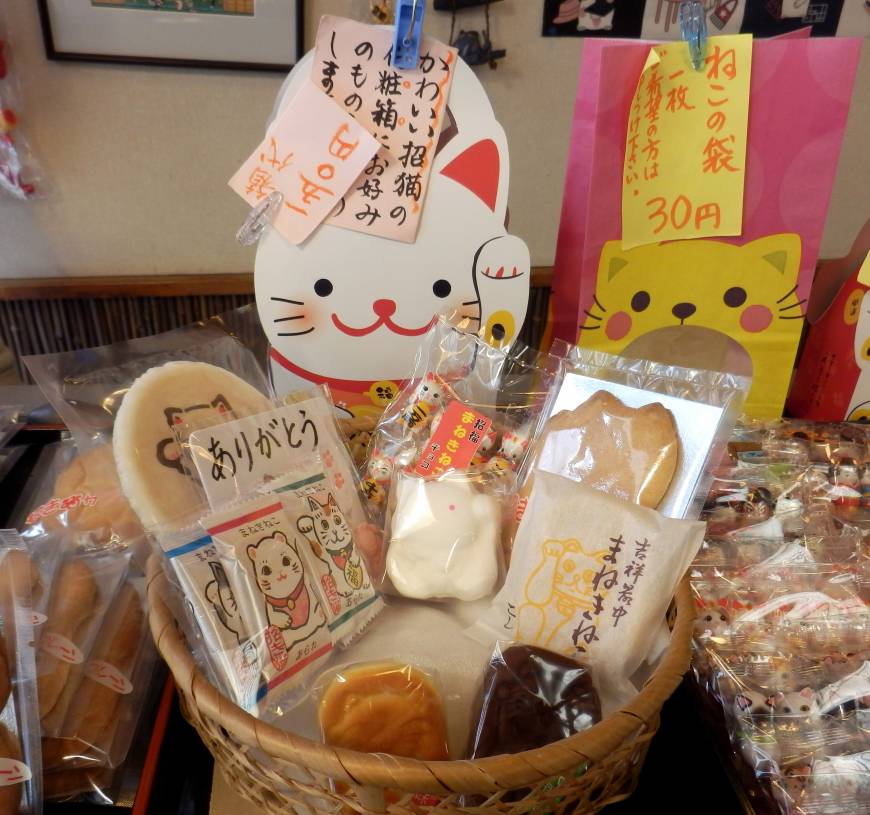 Cookies and Japanese confectionery shaped like maneki neko (beckoning cat) figures are sold at a shop on March 12 in Setagaya Ward, Tokyo.