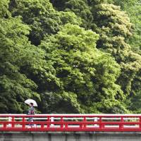 A young woman takes a stroll in downtown Hakone. Hakone in hot water: Romance, gimlets and raunchy 'onsen'