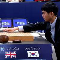 Machine power: Lee Sedol makes the first move in a game against AlphaGo. Human primacy is go-ing, go-ing, gone