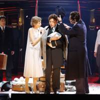 Decision time: Flanked by aging ballerina Elizaveta Grusinskaya (Mira Anju) and wily Baron Felix Von Geigern (Hironobu Miyahara), the Grand Hotel’s concierge (Masaaki Fujioka) holds his newborn baby as the climax approaches in one of Thom Southerland’s two versions of “Grand Hotel.” The double delight of 'Grand Hotel'