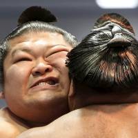 Sumo wrestlers compete during the annual Honozumo ceremonial sumo tournament dedicated to the Yasukuni Shrine on Monday. In pictures: Hakuho headlines somber spring sumo festival at Yasukuni Shrine