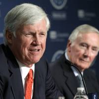 John Stanton (left) speaks at a news conference in Seattle on Wednesday as current Seattle Mariners Chairman and CEO Howard Lincoln looks on. Nintendo plans to sell Mariners majority stake