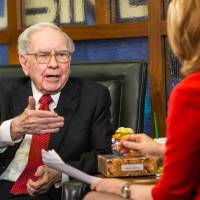 Berkshire Hathaway Chairman and CEO Warren Buffett speaks during a May 2 interview with Liz Claman on the Fox Business Network in Omaha, Nebraska. On Monday, erkshire revealed that the company bought 9.8 million shares of Apple stock. Buffett buoys Wall Street by buying big bite of Apple but China factor sours Europe bourses