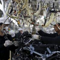 Employees work at the main assembly line of V-6 engine at the Nissan Iwaki Plant in Iwaki, Fukushima Prefecture, Tuesday. Honda, Nissan break April U.S. sales records amid 'full-steam ahead' truck, SUV demand