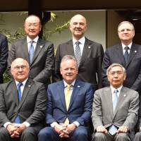 G-7 finance ministers and central bank chiefs pose during a photo session in Sendai on Friday. G-7 finance chiefs grope for unity on stoking world economy