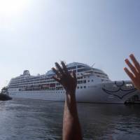 People react during the arrival of U.S. Carnival cruise ship Adonia at the Havana bay, the first cruise liner to sail between the United States and Cuba since Cuba's 1959 revolution, Monday. Cold War thaw: Havana welcomes first U.S. liner to call in over 50 years