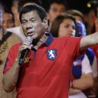 Davao City Mayor Rodrigo Duterte speaks during his final campaign rally in Manila on May 7 ahead of his victory in the Philippines' presidential election. New Philippines leader Duterte plans to strongly push family planning law, aide says