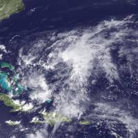 This NOAA/NASA image released Friday and taken by GOES East at 1815 UTC on Thursday shows infrared imagery from the GOES-East satellite of a newly formed area of low pressure centered between Bermuda and the Bahamas, possibly the first cyclone of the season. The coming Atlantic hurricane season is forecast to be near-normal, after three years of unusually low storm activity due in part to the El Nino ocean warming trend, U.S. government scientists said. Tropical depression lashes holiday-crowded South Carolina shores