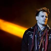 Actor Johnny Depp, the guitarist of the band Hollywood Vampires, performs at the Rock in Rio Lisboa music festival in Lisbon on Friday. Actor Johnny Depp suffers loss of mother, accusations of violence from estranged wife