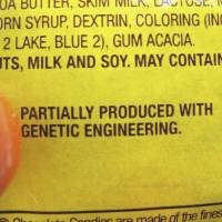 A new disclosure statement is displayed April 8 on a package of Peanut M&M’s candy in Montpelier, Vermont, saying they are “Partially produced with genetic engineering.” Genetically manipulated food remains generally safe for humans and the environment, a high-powered science advisory board declared in a report Tuesday. Sweeping U.S. study finds no evidence GMO crops are unsafe to eat, harmful to environment