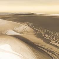 A simulated 3-D perspective view of Mars is seen in an undated image created from data taken by the THEMIS instrument on NASA's Mars Odyssey spacecraft. Climatic cycles of ice and dust build the Martian polar caps, season by season, year by year, and periodically whittle down their size when the climate changes, according to a NASA news release. Radar reveals Mars near end of 370,000-year exit from ice age