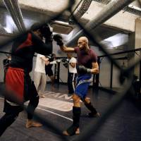 People take part in an MMA (mixed martial arts) training session on May 2 in Paris. Martial arts clubs suspected of being recruiting grounds for would-be jihadis