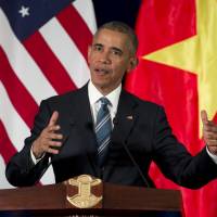 U.S. President Barack Obama speaks during a news conference with Vietnamese President Tran Dai Quang in Hanoi on Monday. At the event Obama announced the lifting of the arms export embargo on Vietnam, removing the final vestige of wartime animosity. Obama lifts arms ban in his first visit to Vietnam