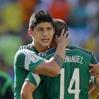 Mexico’s Alan Pulido consoles teammate Javier Hernandez (14) after the Netherlands defeated Mexico 2-1 during the World Cup round of 16 soccer match between the Netherlands and Mexico at the Arena Castelao in Fortaleza, Brazil. A state official says that Mexican soccer star Pulido has been kidnapped in the northern border state of Tamaulipas. The official says the 25-year-old player was kidnapped near his hometown of Ciudad Victoria on Sunday after leaving a party. Mexico prosecutor confirms soccer star Alan Pulido was kidnapped