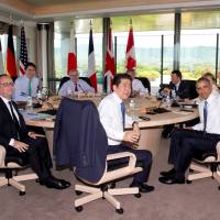 (Clockwise from left) British Prime Minister David Cameron, Canadian Prime Minister Justin Trudeau, European Commission President Jean-Claude Juncker, European Council President Donald Tusk, Italian Prime Minister Matteo Renzi, German Chancellor Angela Merkel, U.S. President Barack Obama, Prime Minister Shinzo Abe and French President Francois Hollande look to the media as they gather to participate in a G-7 Working Session in Shima, Mie Prefecture, on Friday. G-7 broadly agrees on ways to spur growth