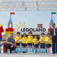 Legoland Japan President Torben Jensen (far left) poses for a photo with children during a ceremony at Nagoya's Minato Ward to announce the planned opening of an amusement park in the city in April next year. Legoland Japan to open in Nagoya in April 2017