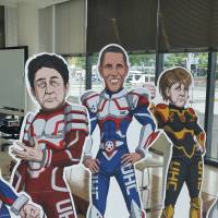 Figures resembling the Group of Seven leaders are displayed at a venue for nongovernmental organization meetings in Ise, Mie Prefecture, on Thursday. NGOs pressure G-7 to take action on Paris climate deal