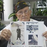 Arthur Ishimoto, 93, a U.S. Army veteran, poses with archival photographs of himself as he is interviewed in Honolulu. Like many Americans, Ishimoto believes dropping the atomic bombs on Nagasaki and Hiroshima saved the lives of possibly a million Americans and even more Japanese. Let Obama's Hiroshima visit open up debate in the U.S. about the nuclear attacks