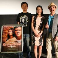 Holding hands: Actors Itsuji Itao, Nanami Kameda, Jay Kabira and director Yoko Narahashi pose for shots at a publicity event for “Hold My Hand.” Japan's 'gatekeeper to Hollywood' Yoko Narahashi brings a playwright's final tale to the big screen with 'Hold My Hand'
