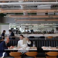 Democratic gastronomy: French Chef Alain Ducasse (left) and his executive chef, Pascal Feraud, discuss the menu prior to the opening of Champeaux in the Les Halles shopping mall in Paris on April 8. Canapes under the canopy? Paris gentrifies rusty mall
